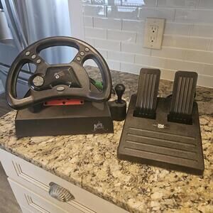 MAD CATZ Analog Steering Wheel and Foot Pedals for PLAYSTATION, 1995